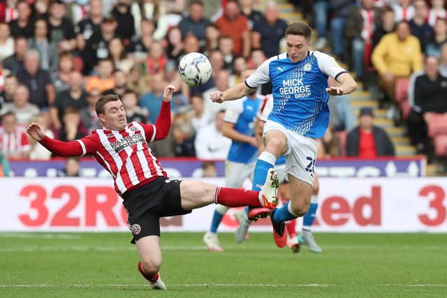 Conor Coventry in action for Posh.