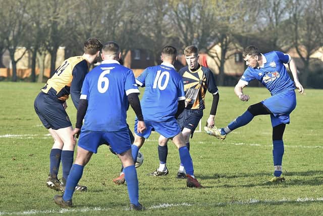 Action from Glinton & Northborough Reserves v Brotherhood (blue) in Division Two of the Peterborough Sunday Morning League. Photo: David Lowndes.