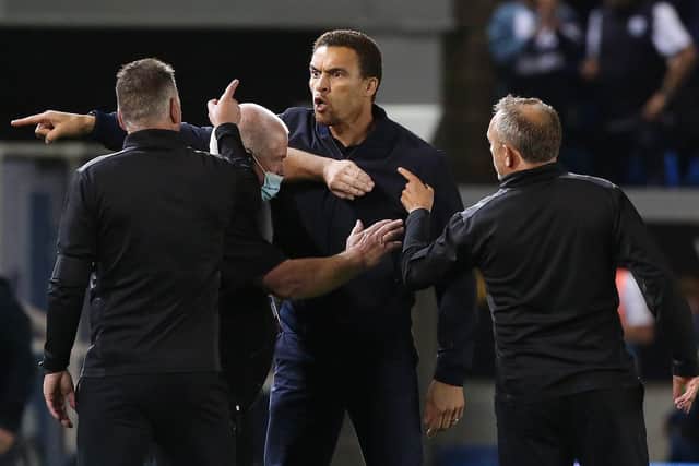 Rival managers Darren Ferguson of Posh (left) and Valerien Ismael of West Bromwich Albion (centre) clash after the Championship game at London Road in August. Photo: Joe Dent/theposh.com.