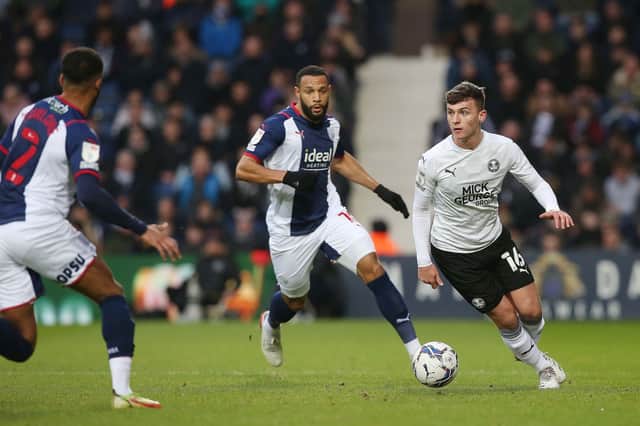 Harrison Burrows of Peterborough United in action with Matt Phillips of West Bromwich Albion - Mandatory by-line: Joe Dent/JMP - 22/01/2022 - FOOTBALL - The Hawthorns - West Bromwich, England - West Bromwich Albion v Peterborough United - Sky Bet Championship EMN-220122-155346005