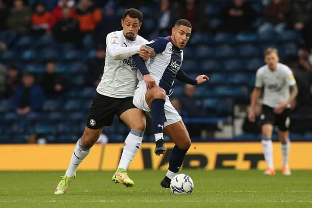 Jonson Clarke-Harris battles with Jake Livermore. Photo: Joe Dent.