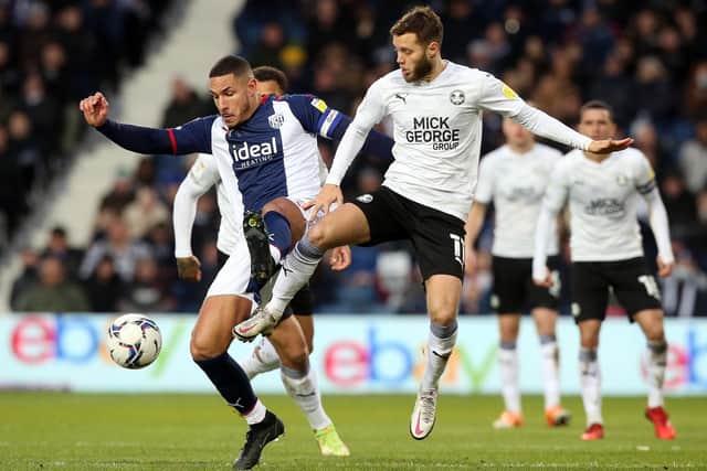 Jorge Grant of Peterborough United in action with Jake Livermore of West Bromwich Albion. Photo: Joe Dent/theposh.com.