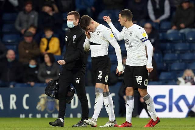 Posh defender Ronnie Edwards leaves the game at West Bromwich Albion because of a concussion injury. Photo: Joe Dent/theposh.com.