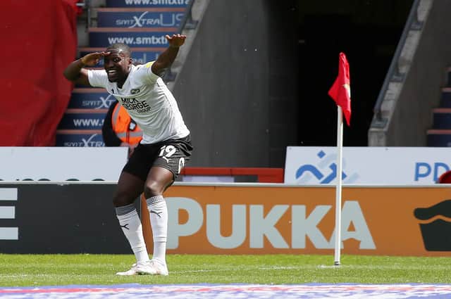 Idris Kanu celebrates his goal for Posh at Doncaster last season.