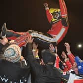 Panthers star Scott Nicholls receives the traditional speedway bumps after the club's Premiership Grand Final success in 20201
