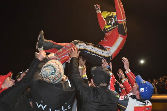 Panthers star Scott Nicholls receives the traditional speedway bumps after the club's Premiership Grand Final success in 20201