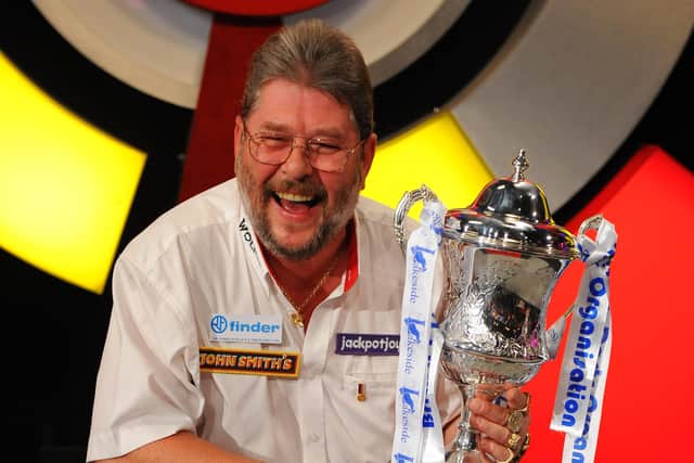 Martin Adams with the 2011 BDO World Championship trophy. Photo: PA Wire.