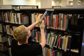 Libraries are under threat. (Photo by OLI SCARFF/AFP via Getty Images)