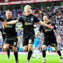 Craig Mackail-Smith celebrates his goal for Posh in the League One play-off final against Huddersfield at Old Trafford in May, 2011.