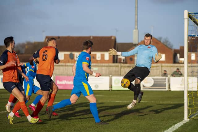 A header from Michael Gash of Peterborough Sports is saved by the Stratford 'keeper.  Photo: James Richardson.
