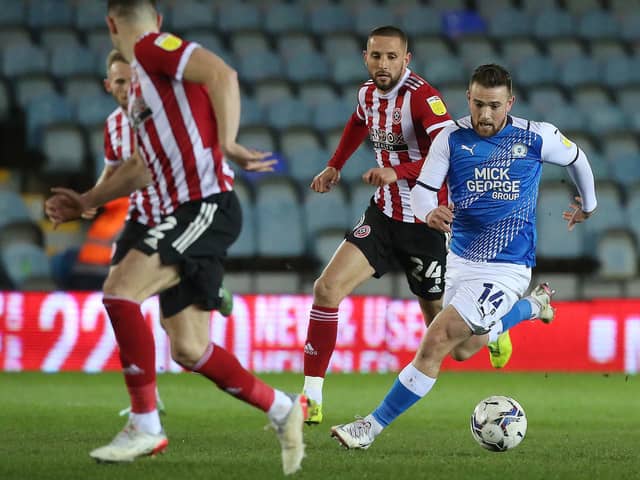 Jack Marriott of Peterborough United in action with Conor Hourihane of Sheffield United .Photo: Joe Dent/theposh.com.