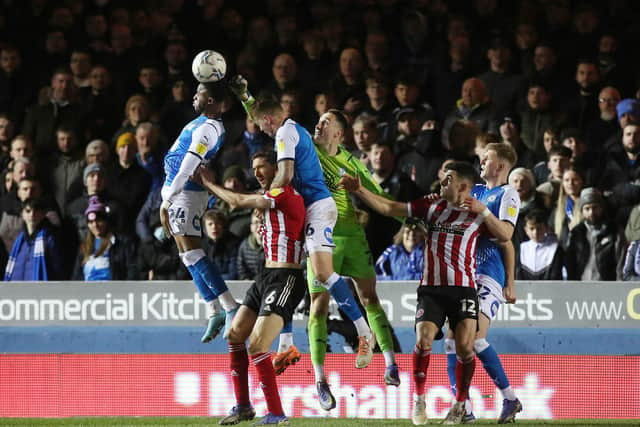 Steven Benda of Peterborough United challenges for the ball against Sheffield United. Photo: Joe Dent/theposh.com.