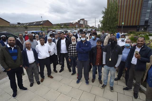 Over 100 hackney carriage drivers gathered outside Sandmartin House in protest in June.