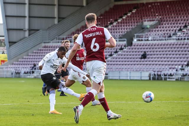Reece Brown scores for Posh against Northampton Town last season.
