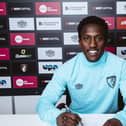 Siriki Dembele signs for Bournemouth. Photo: Courtesy of AFC Bournemouth.