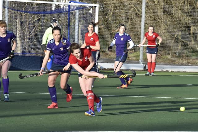 Action from City of Peterborough Ladies seconds (red) against Cambridge South at Bretton Gate. Photo: David Lowndes.