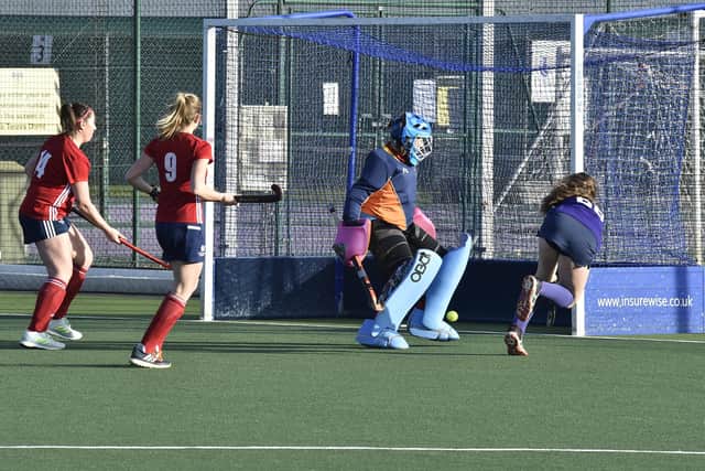 Action from City of Peterborough Ladies seconds (red) against Cambridge South at Bretton Gate. Photo: David Lowndes.