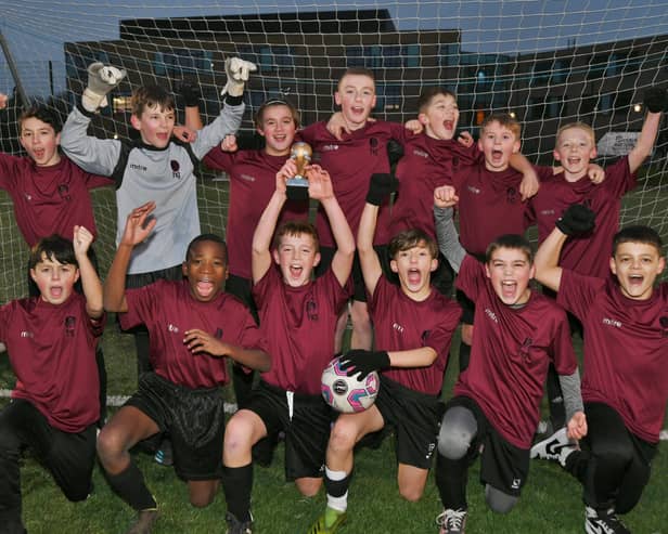 The Hampton Gardens year seven side celebrate their cup final win. Photo: David Lowndes.