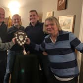 The picture shows Alan Jones, co-organiser, presenting the trophy to The Walnut Tree team, left to right: John Yardy, Keith Fowler, Steven Toms and Danny Knight.