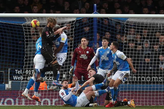 Goalmouth action between Peterborough United and Queens Park Rangers.  Photo: Joe Dent/theposh.com.