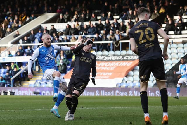 Joe Ward of Peterborough United scores the opening goal of the game against Queens Park Rangers in the fourth round FA Cup tie. Photo: Joe Dent/theposh.com.