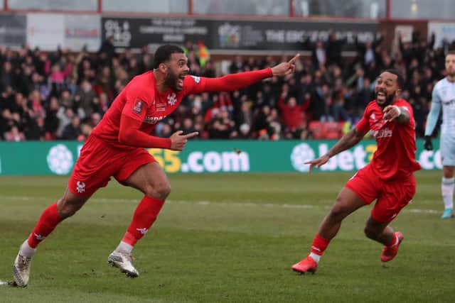 Alex Penny (left) celebrates his goal for Kidderminster against West Ham United. Photo: Geoff Caddick/AFP.