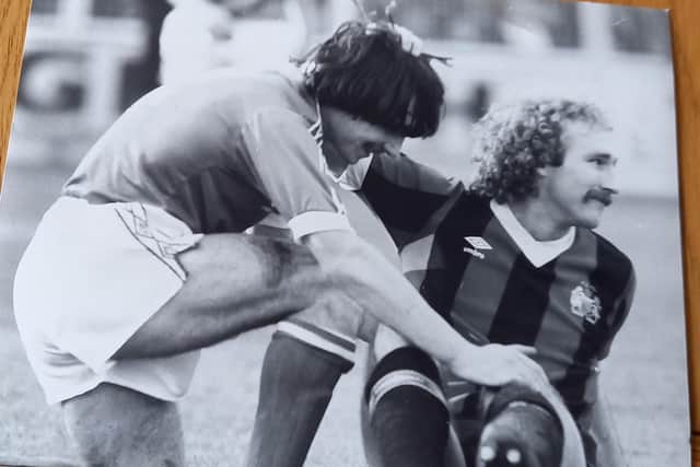 Micky Gynn (left) of Posh and Gerry Gow of Manchester City in the 1981 FA Cup fifth round tie at London Road.