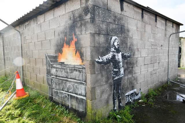 Banksy's Season's Greetings which depicts a message about the impact of pollution on communities and appeared on the outside of a steelworker's private garage in Taibach, Port Talbot on December 19 2018. pa-new/ARTS Banksy  19040717.JPG