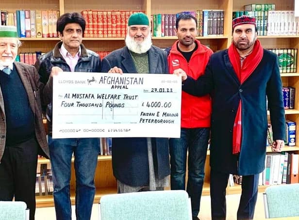 Chairman of Faizan e Madinah Abdul Choudhuri presenting the cheque to chairman of Al Mustifa Welfare Trust- (on right) - also present in photo are Whajid Hussain - news paper columnist of Daily Jang, Imam Muhammad Nawaz Hazarvi and Zeshan Ahmed.
