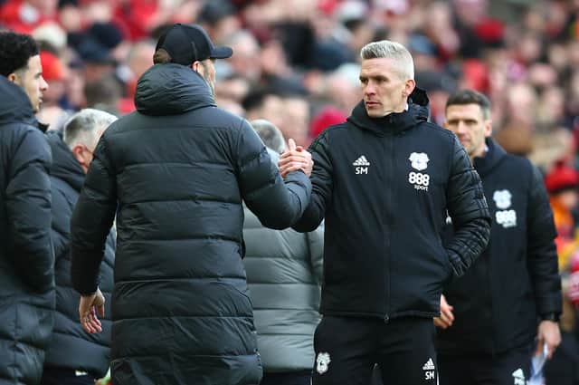 Steve Morison shakes hands with Liverpool manager Jurgen Klopp after their FA Cup tie. Photo: Clive Brunskill/Getty Images.