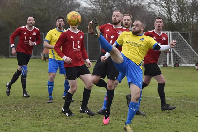 Action from Sawtry (yellow) v Tydd Reserves at Greenfields. Photo: David Lowndes.