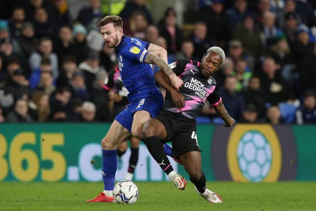Jeando Fuchs of Peterborough United battles with Joe Ralls of Cardiff City. Photo: Joe Dent/theposh.com.