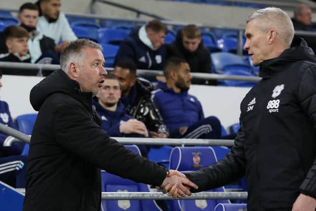 Peterborough United Manager Darren Ferguson shakes hands with Cardiff City Manager Steve Morison before the match. Photo: Joe Dent/theposh.com.