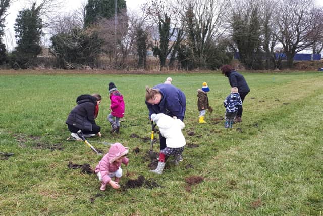 Children from Shiny Stars playgroup taking part in the planting