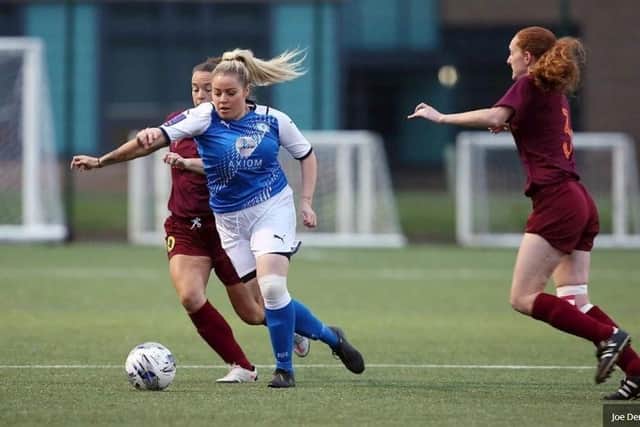 Cassie Steward (blue) set up a late chance for Posh Women at Boldmere St Michael.