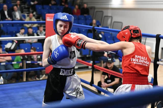 Emily Anderson (blue headgear) boxing for the Police club at the Queen Katharine Academy. Photo: David Lowndes.