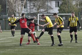 Action from a recent Crowland (yellow) game in the Senior Cup.