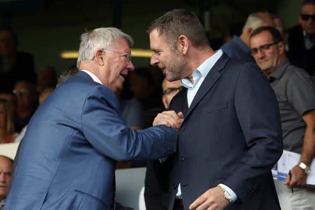 Posh chairman Darragh MacAnthony (right) with legendary Manchester United boss Sir Alex Ferguson.