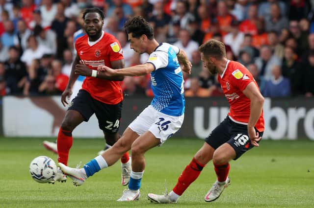 Joel Randall in action for Posh on the opening day of the Championship season at Luton Town.