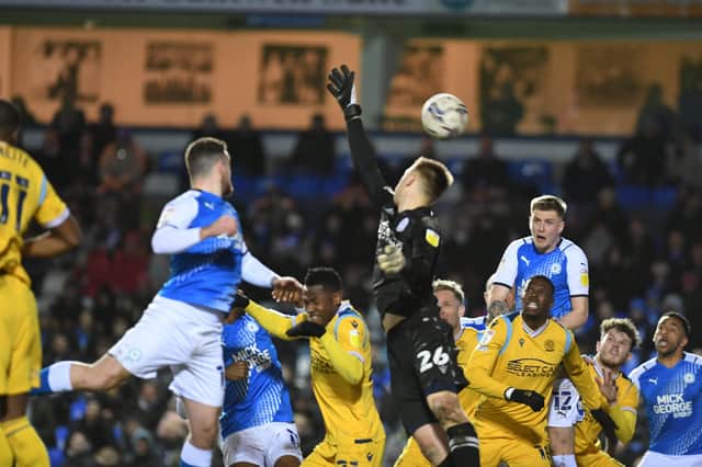 Posh defender Josh Knight is about to head over the bar from close range against Reading. Photo: David Lowndes.