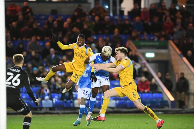 Posh midfielder Jeando Fuchs sends a header goalwards against Reading. Photo: David Lowndes.