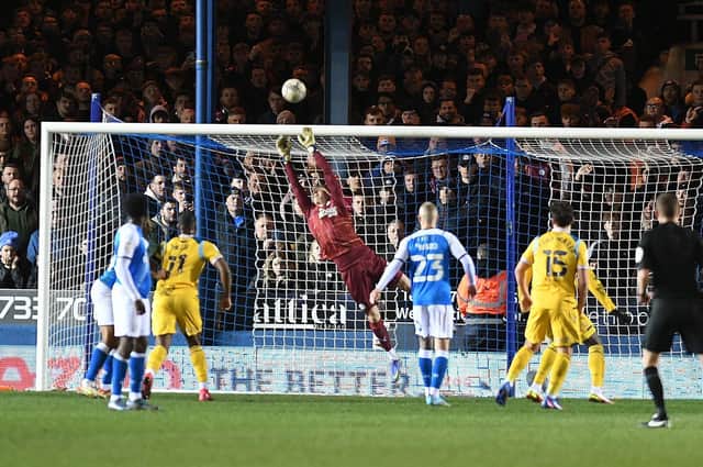 Posh goalkeeper Stephen Benda makes a save from a free kick from Tom Ince. Photo: David Lowndes.