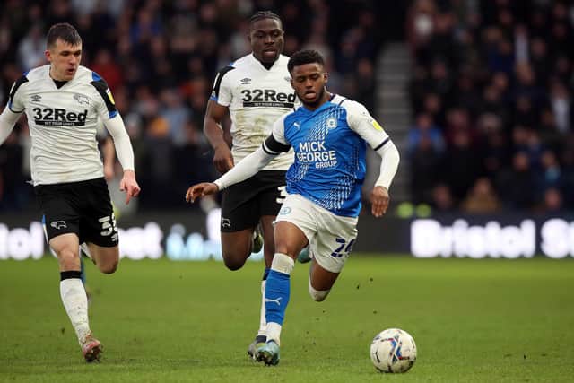 Bali Mumba of Peterborough United brings the ball forward against Derby County. Photo: Joe Dent/theposh.com.