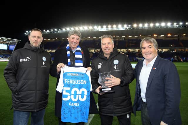 Darren Ferguson (third right) with the Posh co-owners, from left, Darragh MacAnthony, Dr Jason Neale and Stewart 'Randy' Thompson  after a presentation to celebrate his 500 games at club boss.