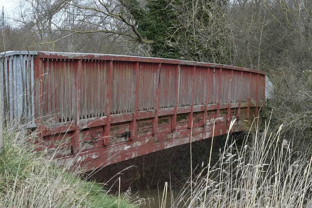 Footbridge over channel from River Nene to Thorpe Meadows. EMN-220221-142344009