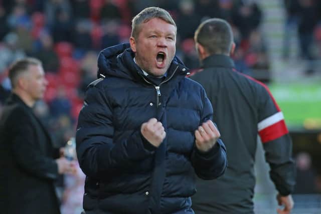 Grant McCann celebrates a controversial goal for Doncaster Rovers against Posh in 2019.