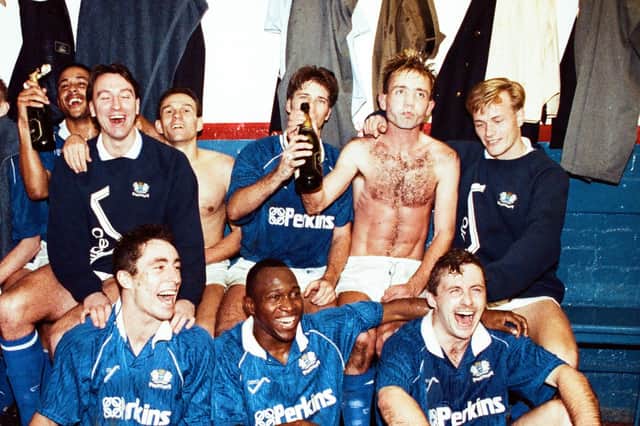 Posh celebrate the famous win over Liverpool in 1991. Mick Halsall is bare-chested, second right, on the back row.