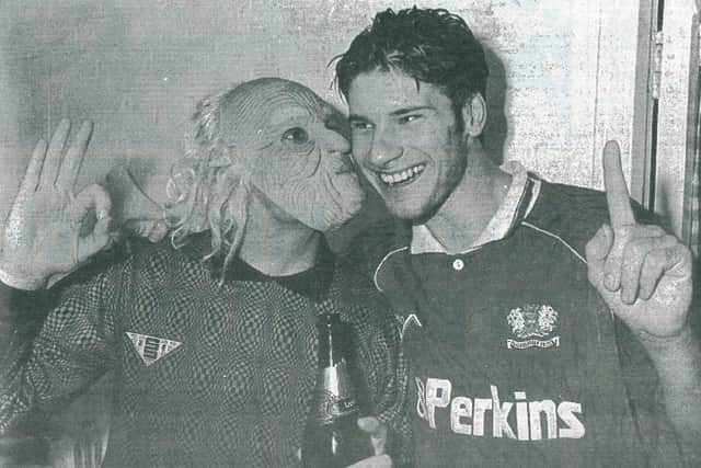 Posh goalkeeper Fred Barber (masked) and goalscorer Garry Kimble after the historic win over LIverpool.
