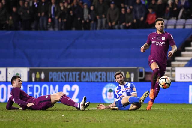 Will Grigg scores for Wigan to knock Manchester City out  of the FA Cup in 2018. Photo: Michael Regan/Getty Images.