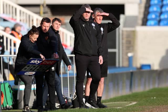 Peterborough United Manager Grant McCann and Assistant Manager Cliff Byrne during the game against Hull. Photo: Joe Dent/theposh.com.